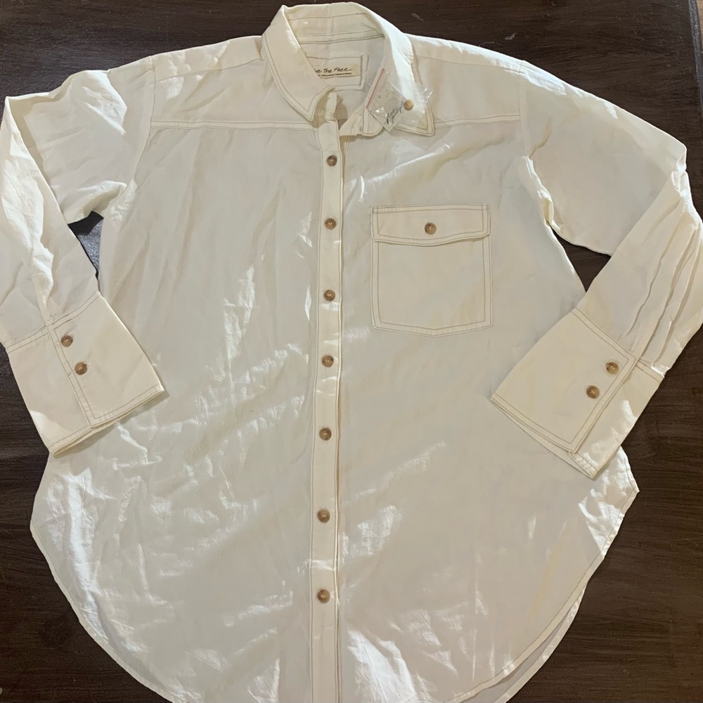 New With Tags. We the free  Cream Button-Up Shirt size small